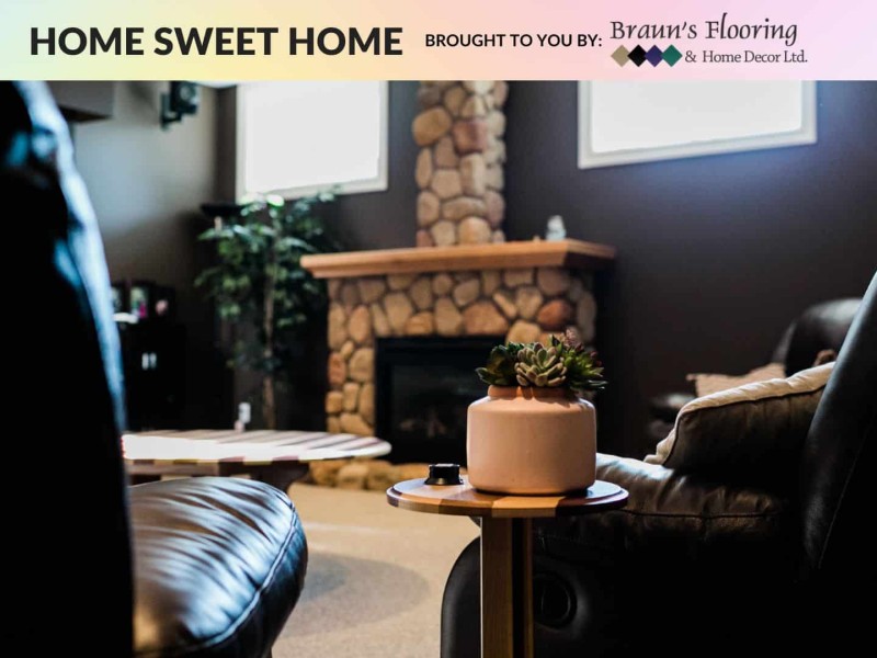 Back of chair in front of stone fireplace