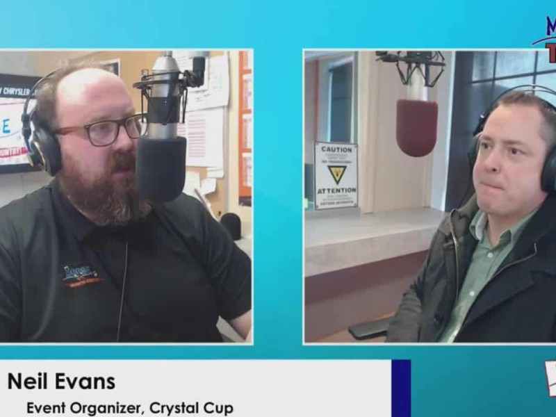 Man on left behind microphone