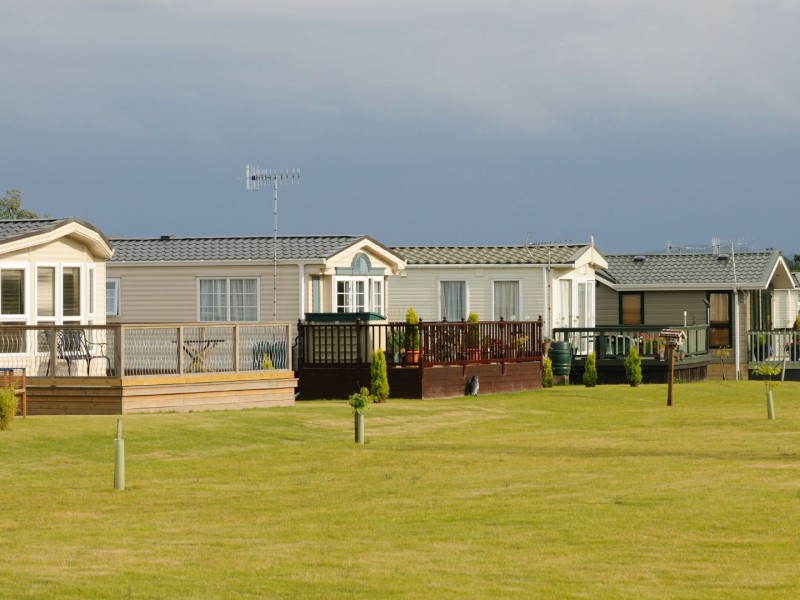 Generic mobile homes in a row with decks.