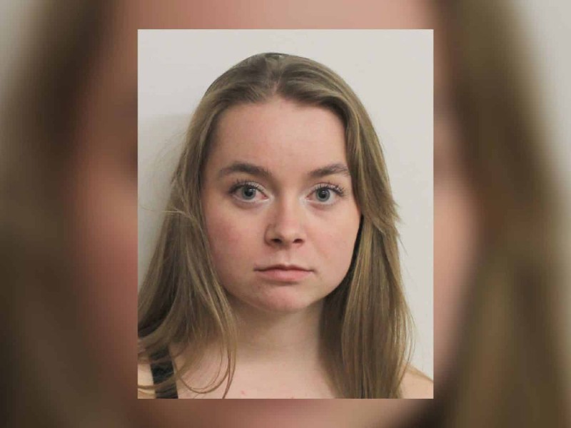Mugshot of a young woman with long brown hair.