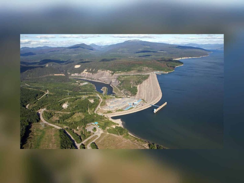 The Williston Reservoir. A picture of a large lake with hydro energy buildings on the coast.