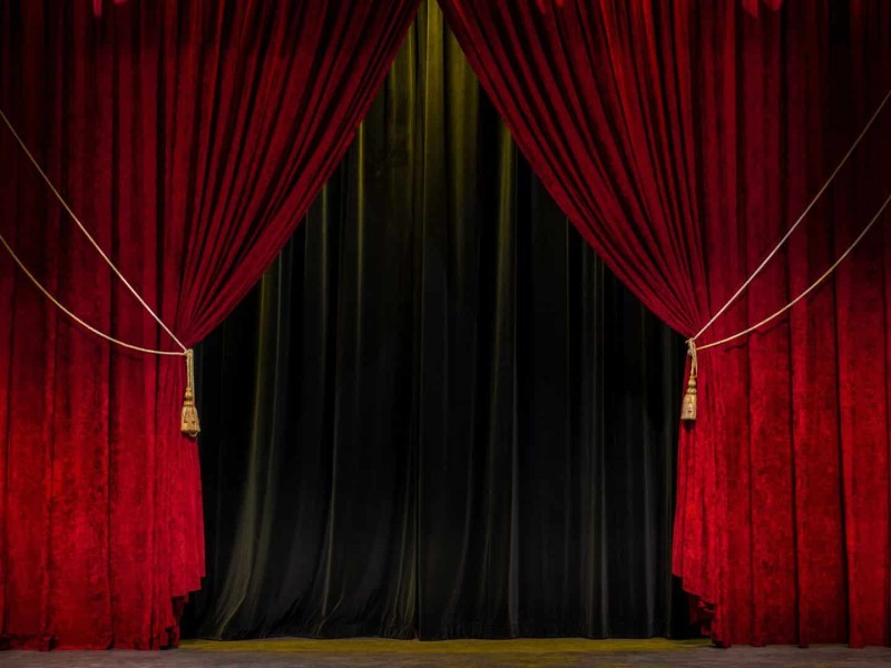 Stage and red theatre curtains