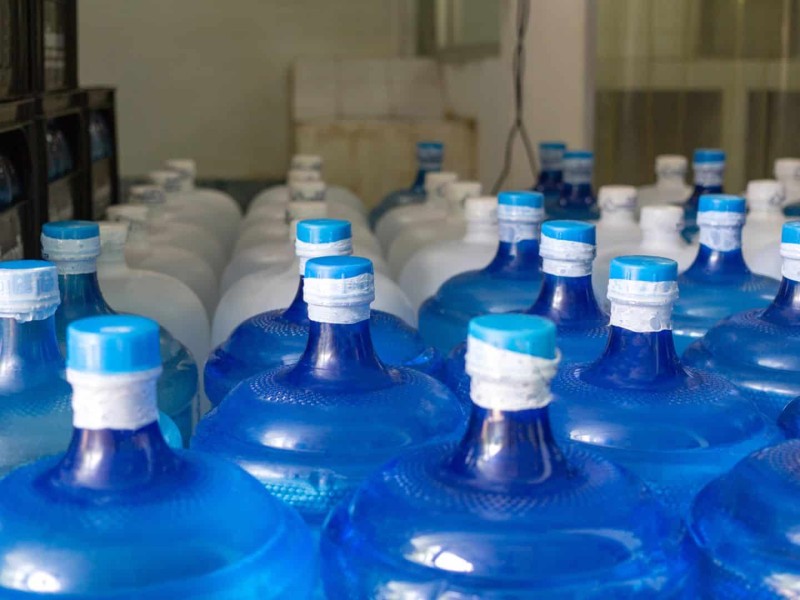 A few five gallon water bottles. (Canva)