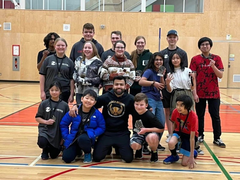 Peace Region Badminton & Recreational Club tournament winners and head coach. (Supplied)