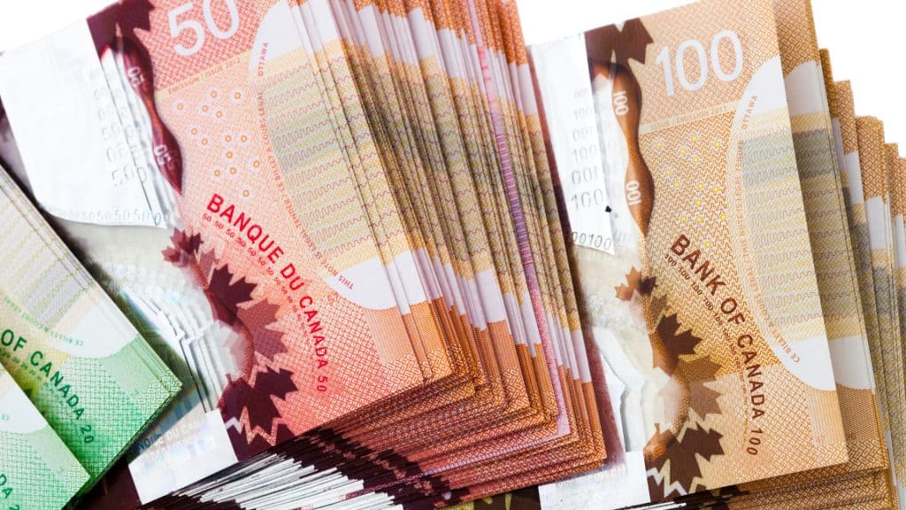 A stack of Canadian bills. (Canva)
