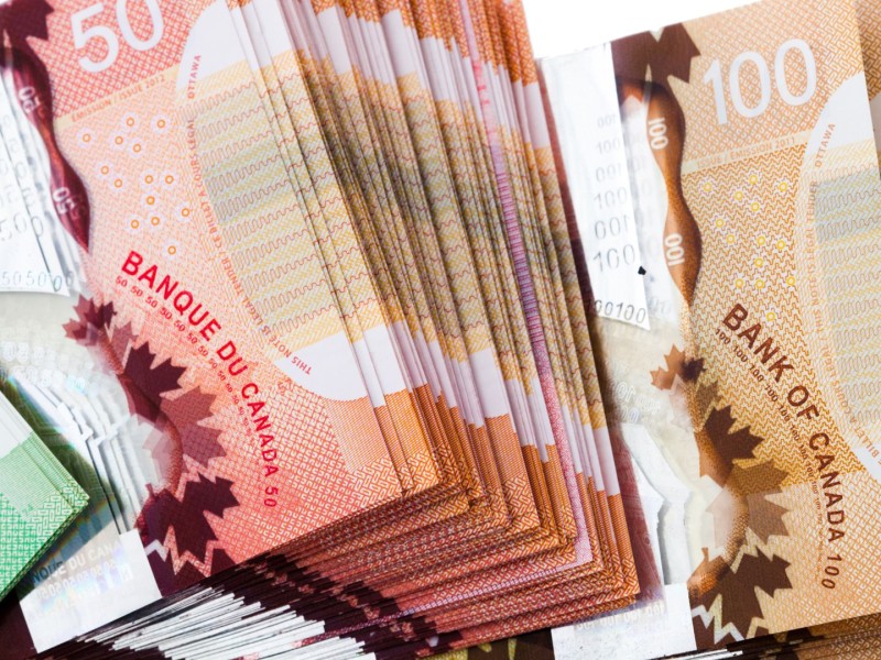 A stack of Canadian bills. (Canva)