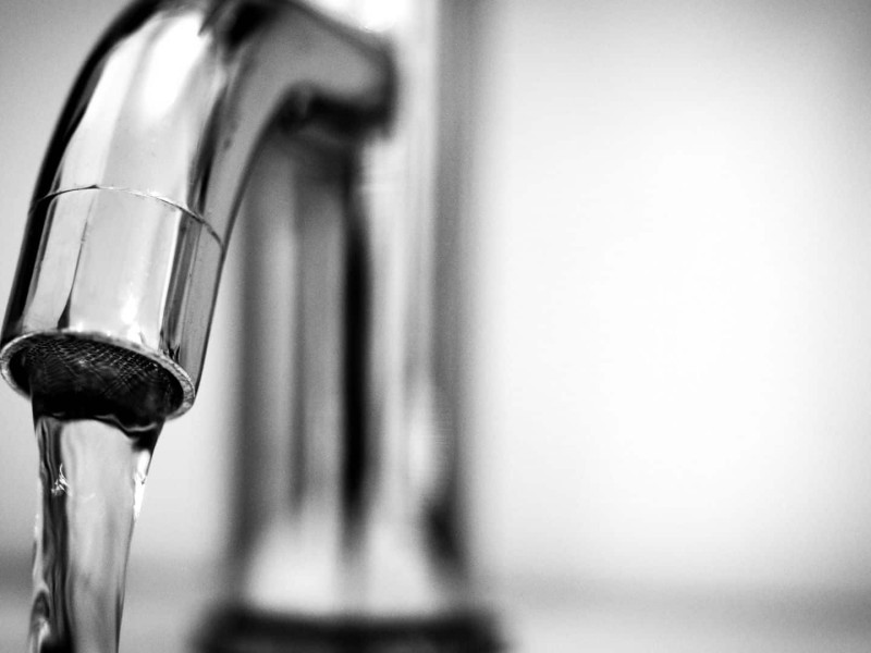 A faucet with tap water.