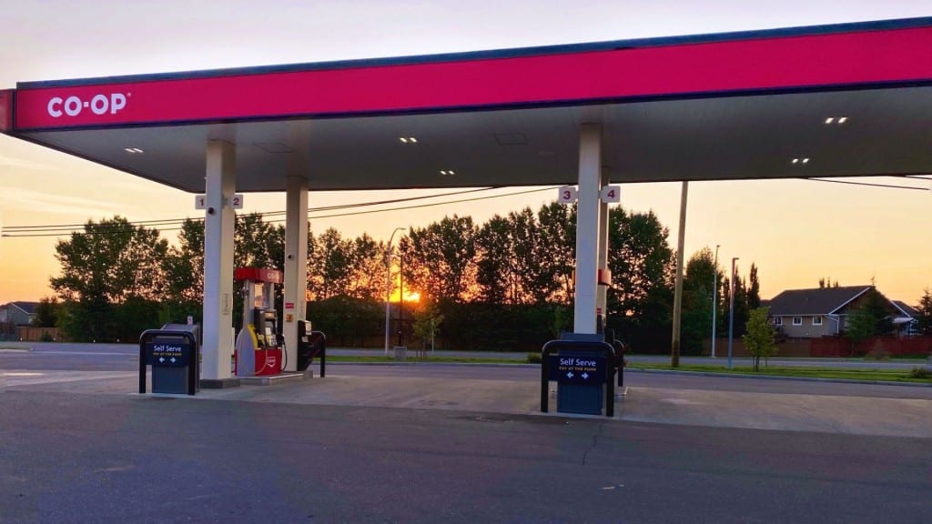 A picture of the Co-op gas station in Fort St. John with a sunset in the background.