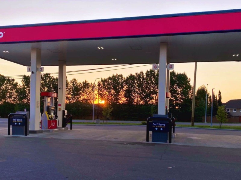 A picture of the Co-op gas station in Fort St. John with a sunset in the background.