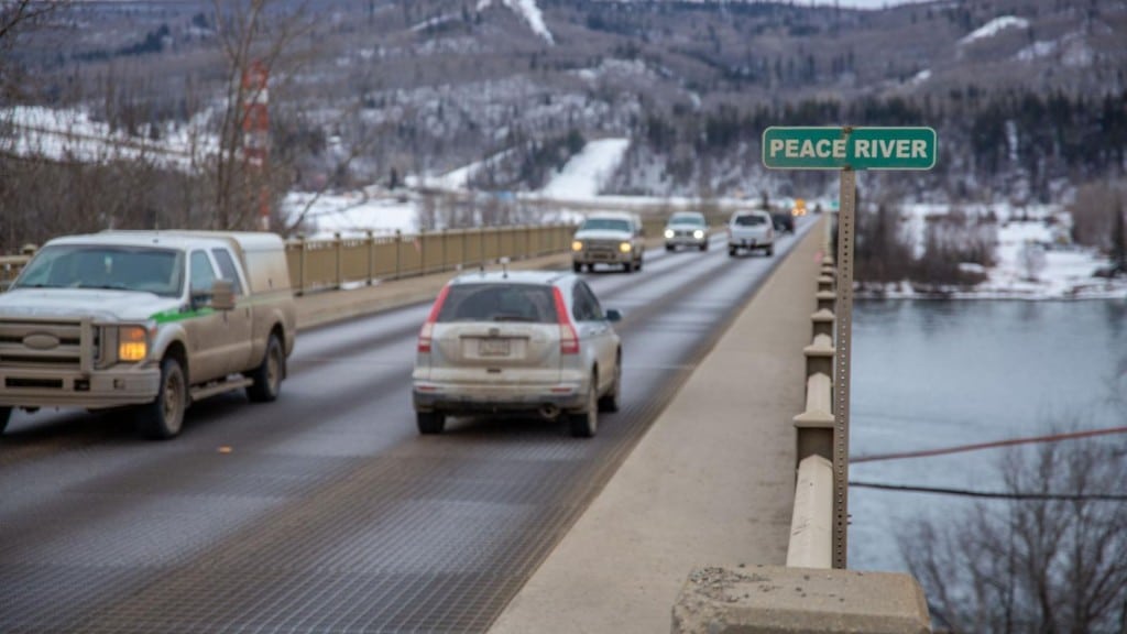 A concrete and metal grate bridge.