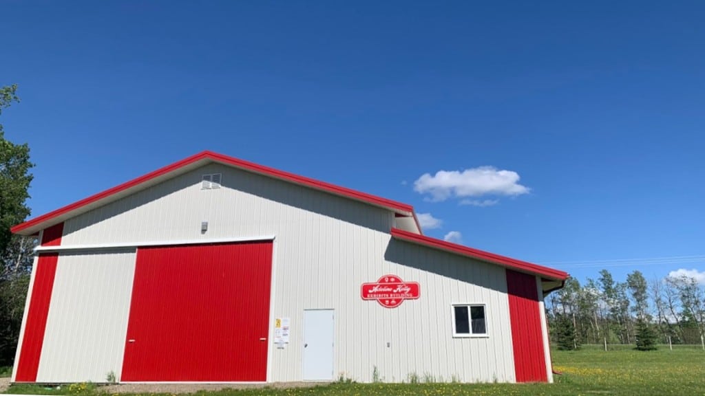 A large white and red building.