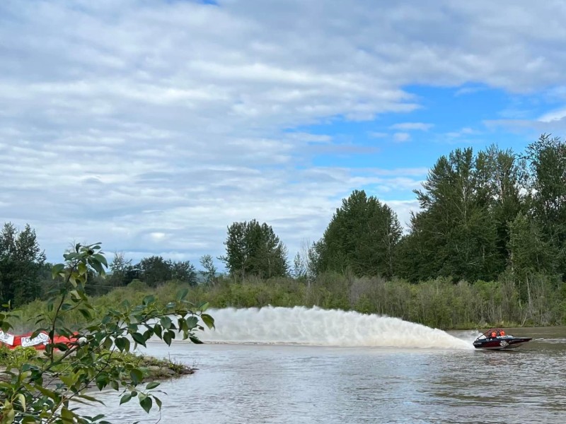 A speed boat race along a river.