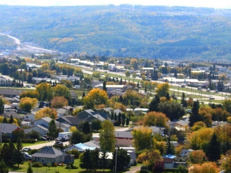 An aerial shot of a small town located in a valley.