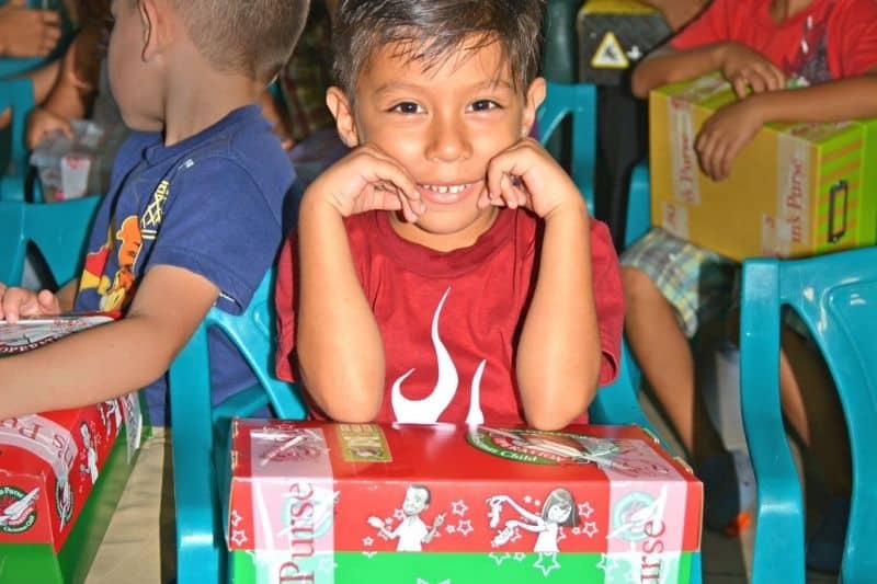 Children in Costa Rica opening shoeboxes from Operation Christmas Child