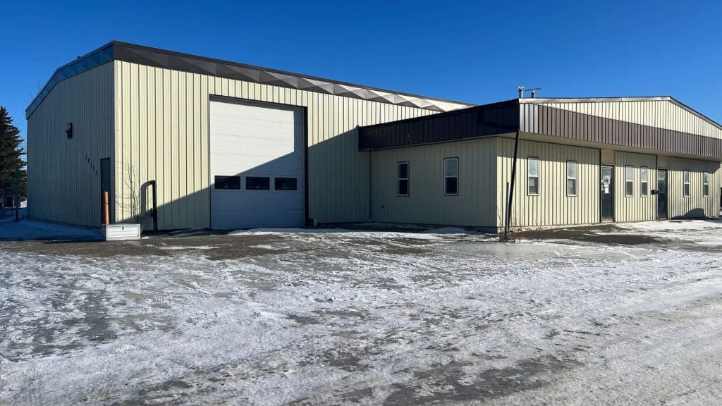 a large white building with a large shop on its side, the new location of the North peace BC SPCA.
