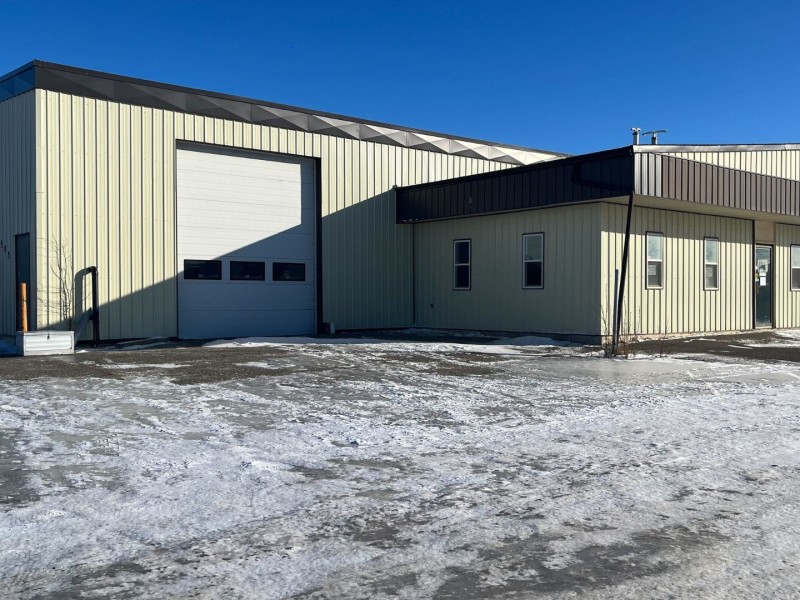 a large white building with a large shop on its side, the new location of the North peace BC SPCA.