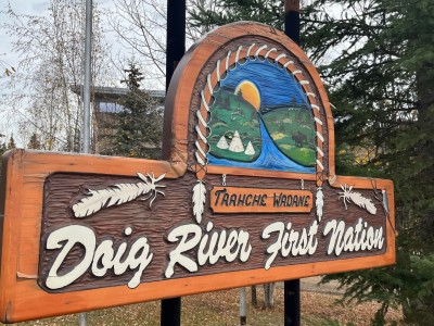 A wooden sign that reads "Doig River First Nation."