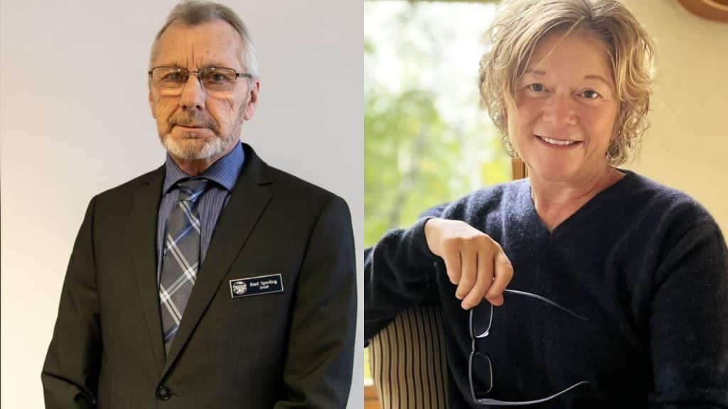 An older man in a suit, and an older woman in a sweater.