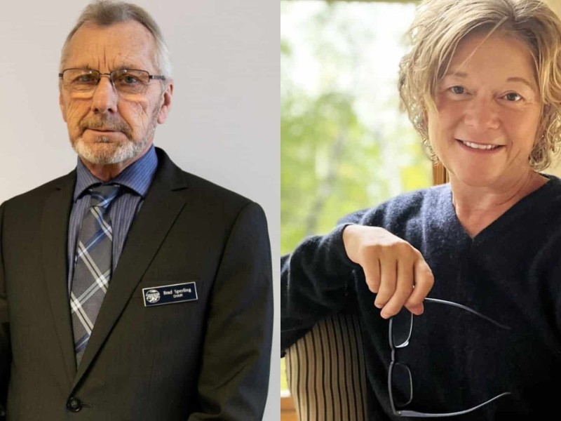 An older man in a suit, and an older woman in a sweater.