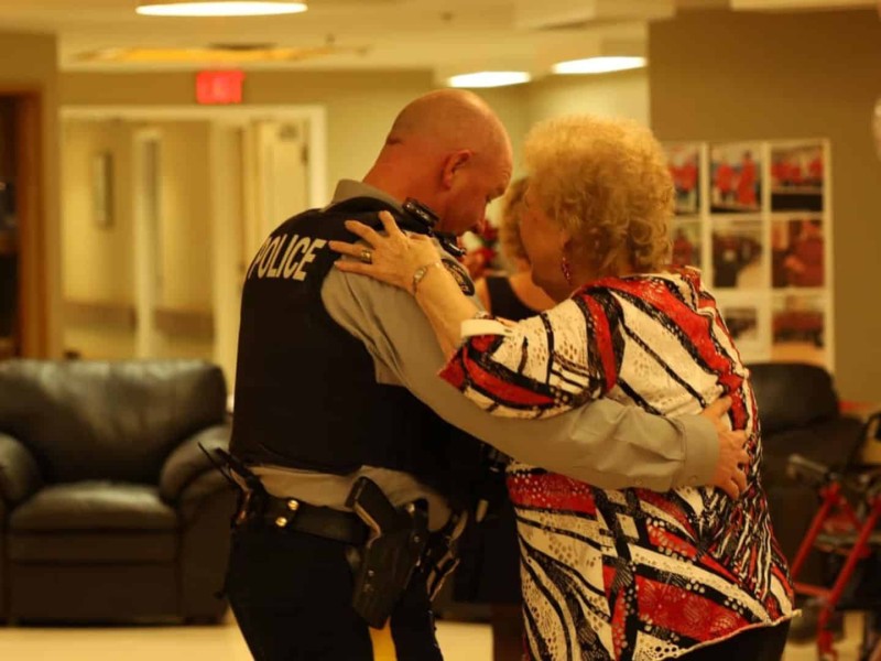 An RCMP officer dancing with a senior woman at a Valentine's Day dance.