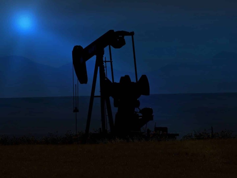 An oil pump at night.