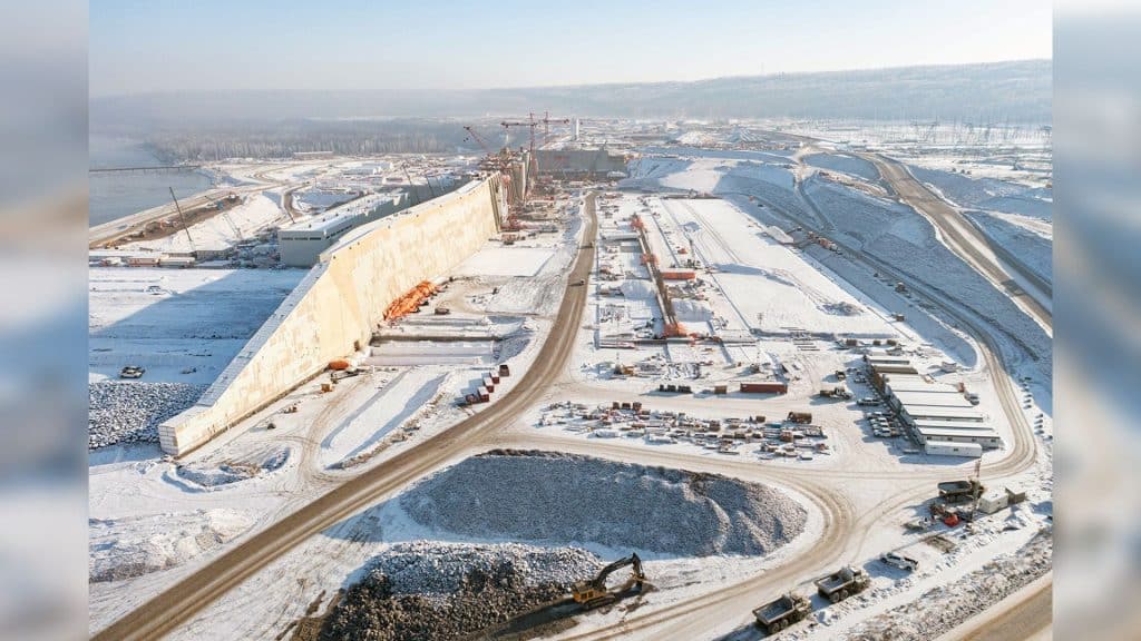 A wide shot of the Site C project covered in snow.