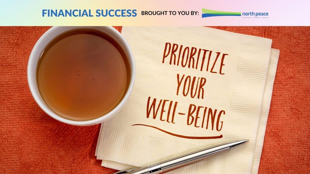 A cup of coffee on a napkin with the words prioritize your well-being written on it