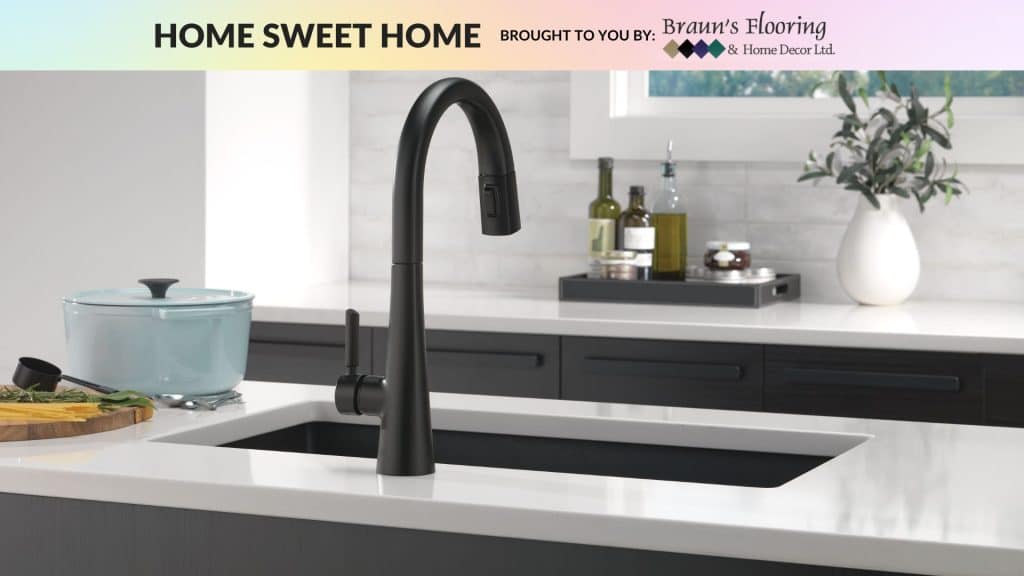 Black sink in a marble countertop