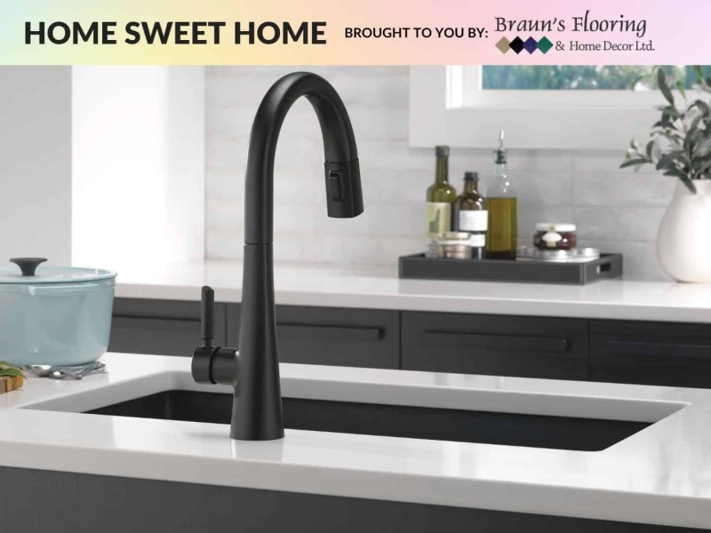 Black sink in a marble countertop
