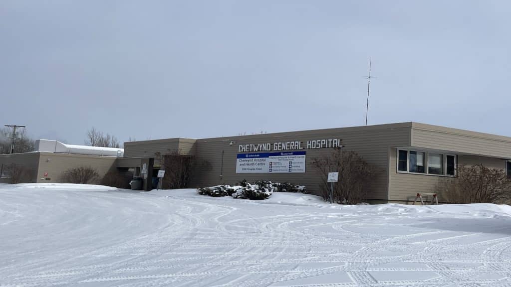 A picture of a grey building in a snowy landscape.