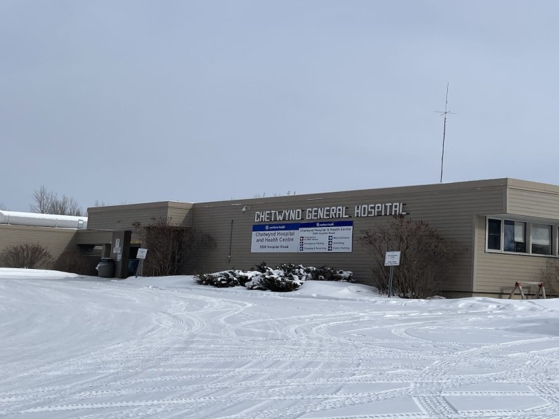 A picture of a grey building in a snowy landscape.