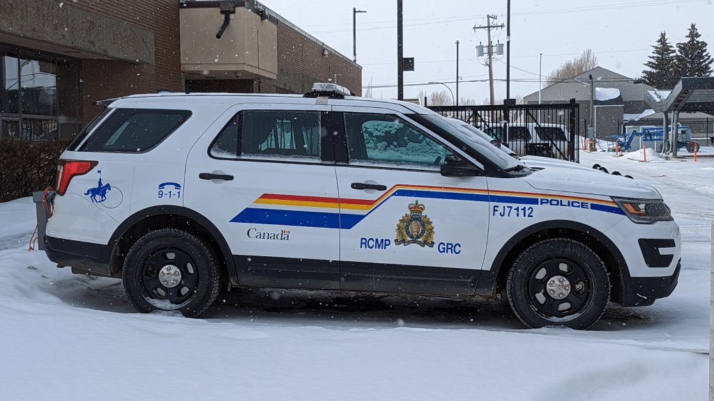A RCMP cruiser in a winter parking lot.