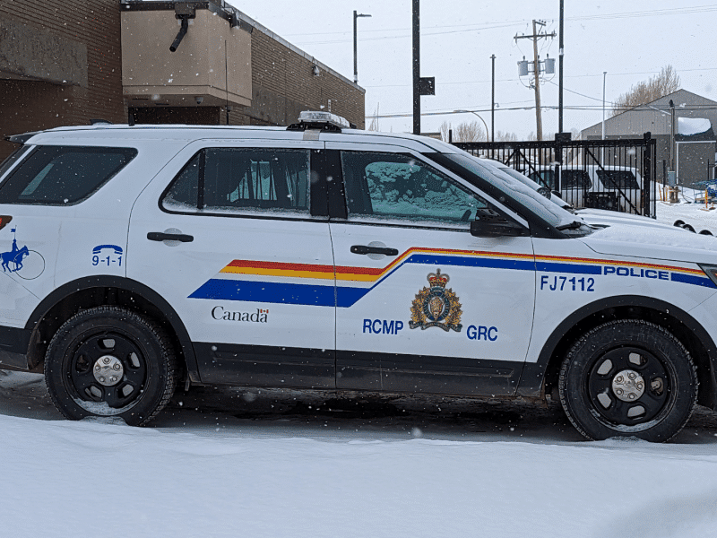 A RCMP cruiser in a winter parking lot.