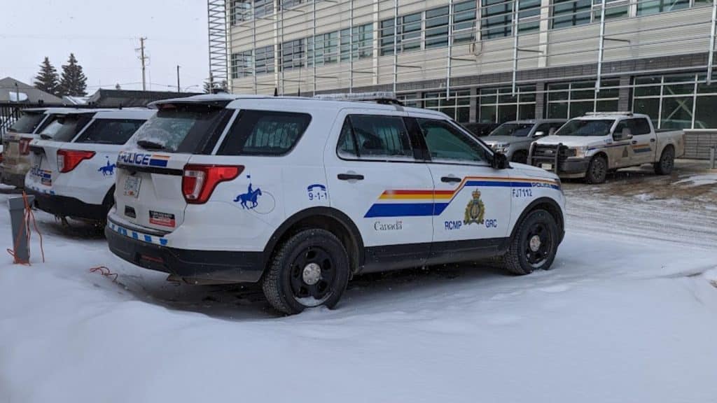 A RCMP cruiser in a winter parking lot.