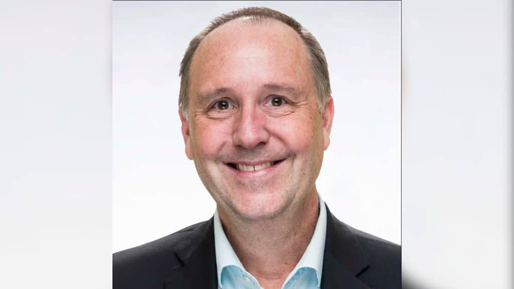 A portrait photo of a late middle aged man.