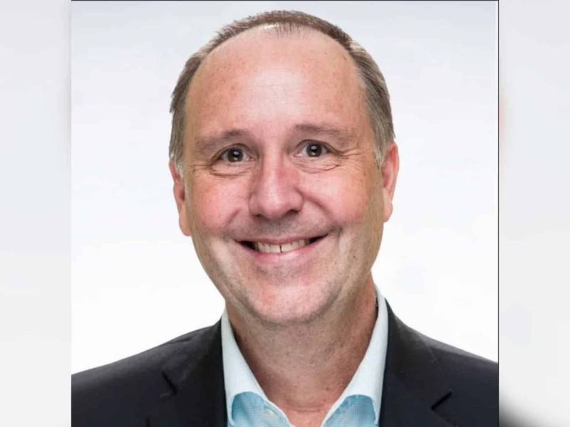 A portrait photo of a late middle aged man.