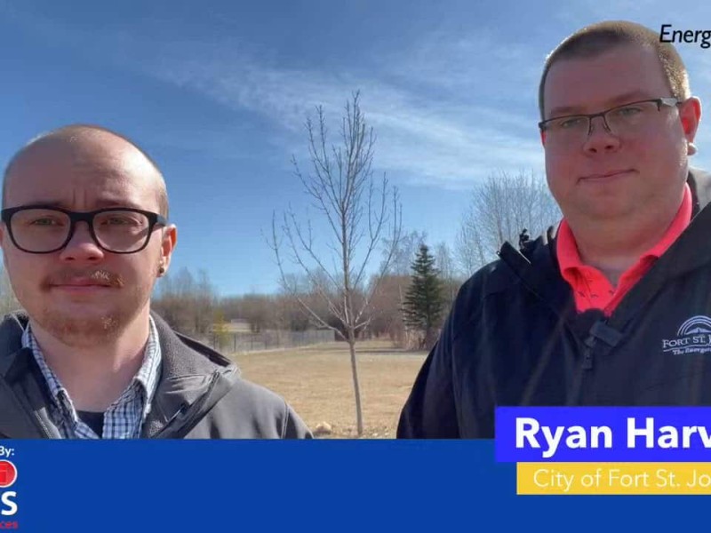 Two people smiling at the camera