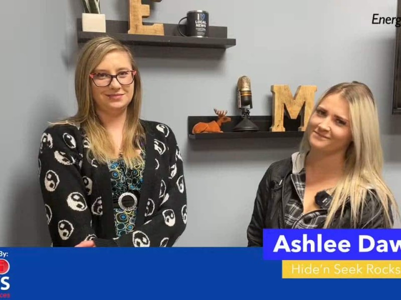 Two people smiling at the camera