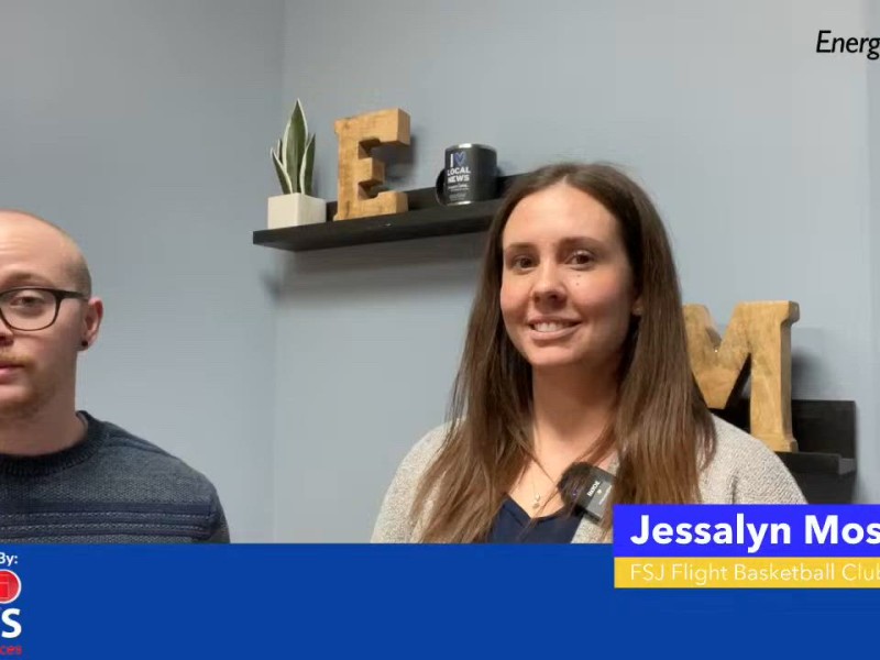 Two people smiling at the camera