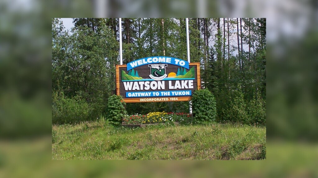 A wooden sign for the town of Watson Lake Yukon.