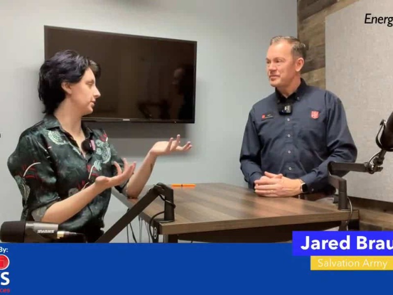 Two people talking at a table