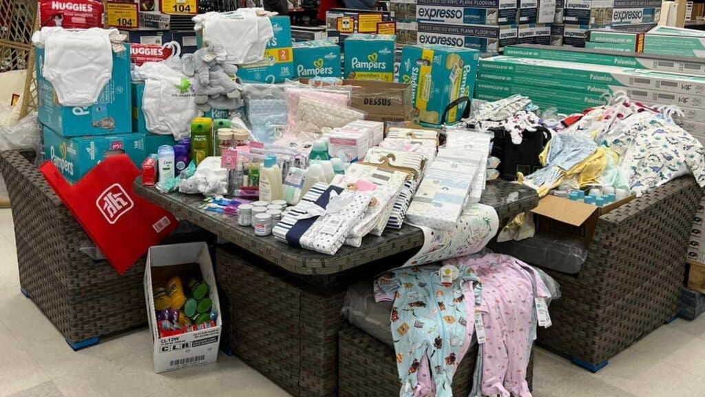 A large pile of baby items inside a Home Hardware store.
