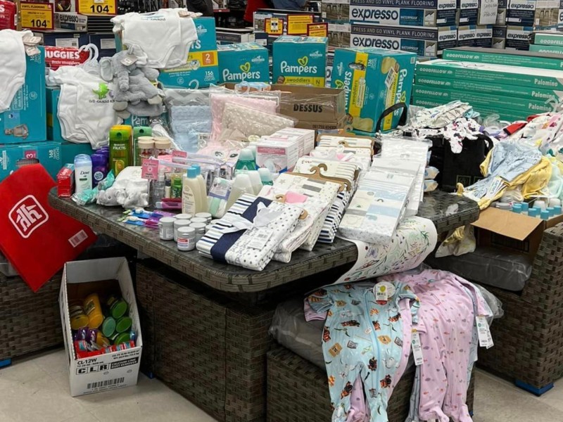 A large pile of baby items inside a Home Hardware store.