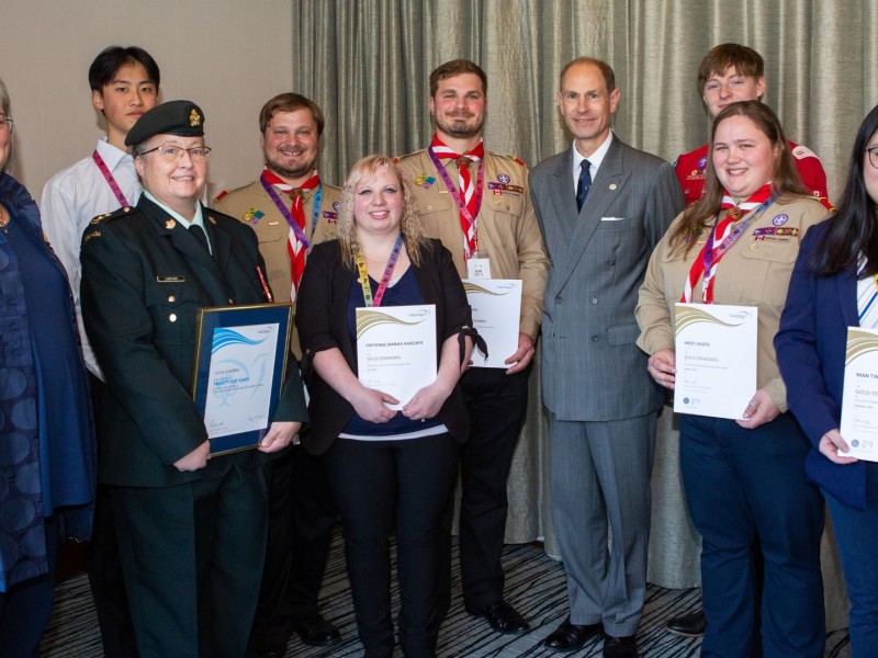 A group of people holding awards, including Prince Edward.