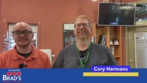 Two people smiling a the camera