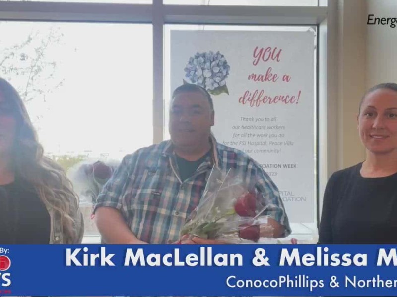 Three people smiling at the camera