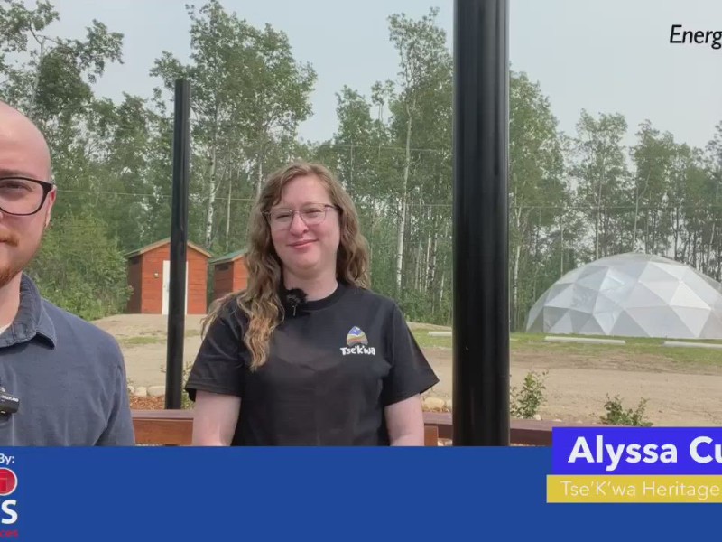 Two people smiling at the camera