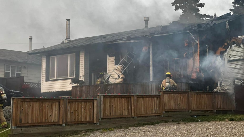 Firefighters responding to a house fire.