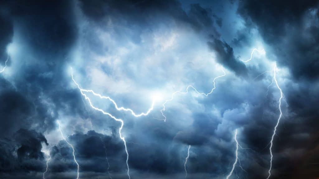A stock image of a lightning storm and cloudy skies.