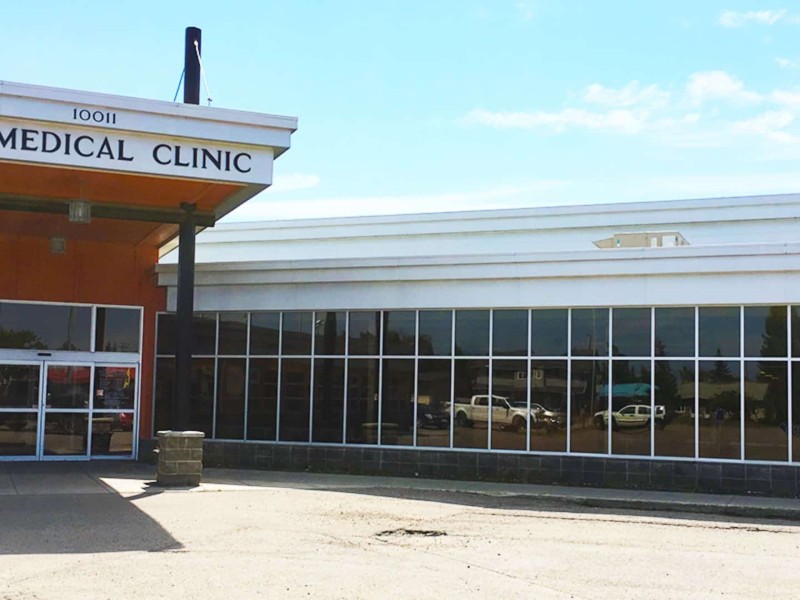 The FSJ Medical Clinic building from the outside, brick building with many mirrored windows.